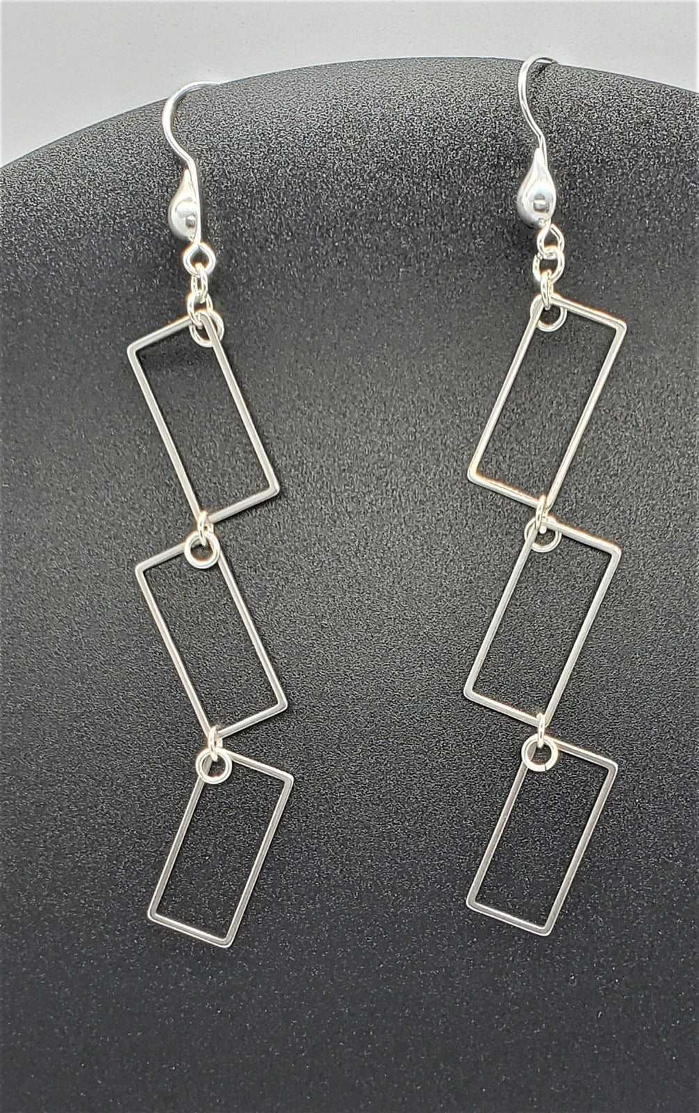 Photo of earrings on black background, handmade earrings, earrings by Jiana Deon, Rectangle Dangle Earrings