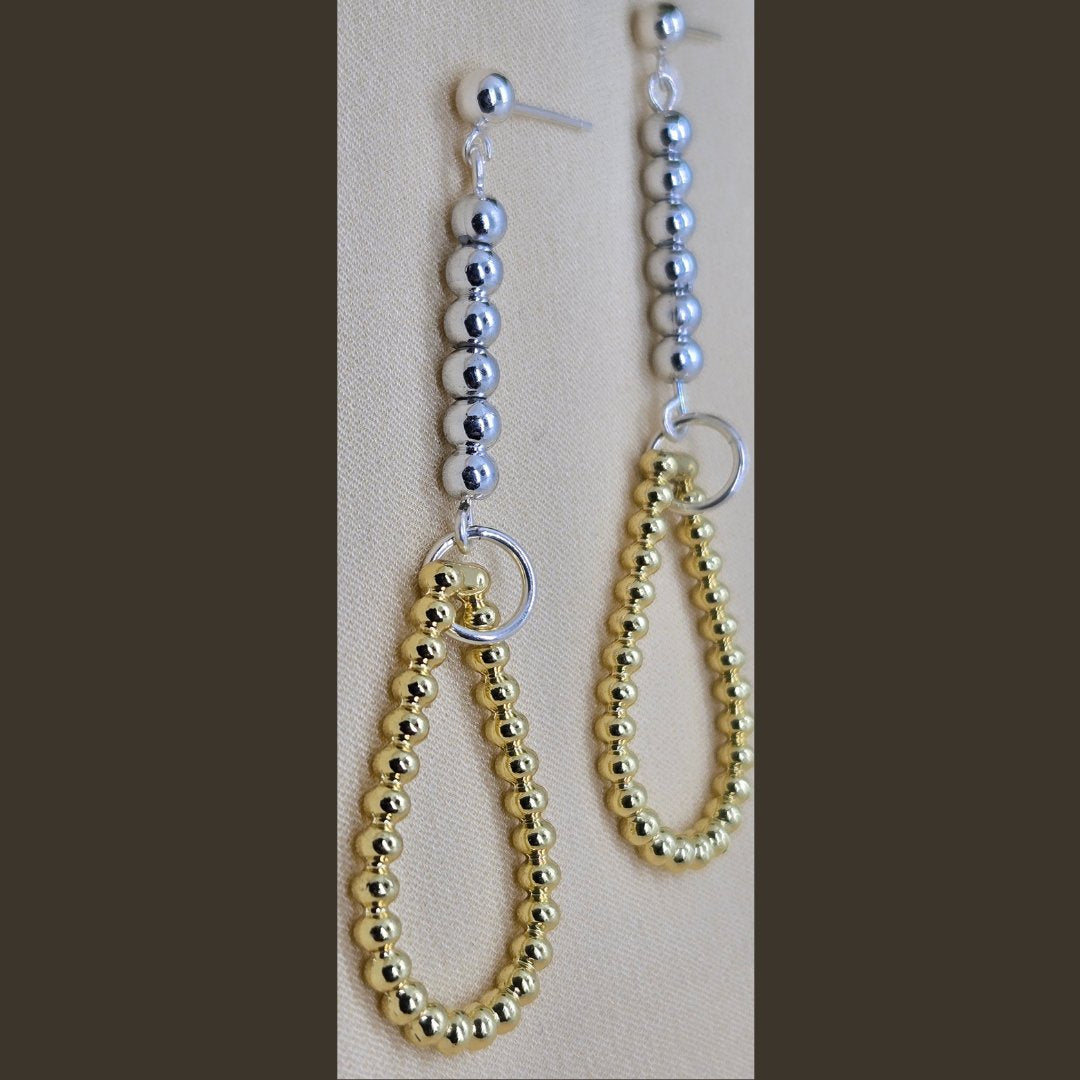 Photo of sterling silver teardrop earrings, handmade by Jiana Deon