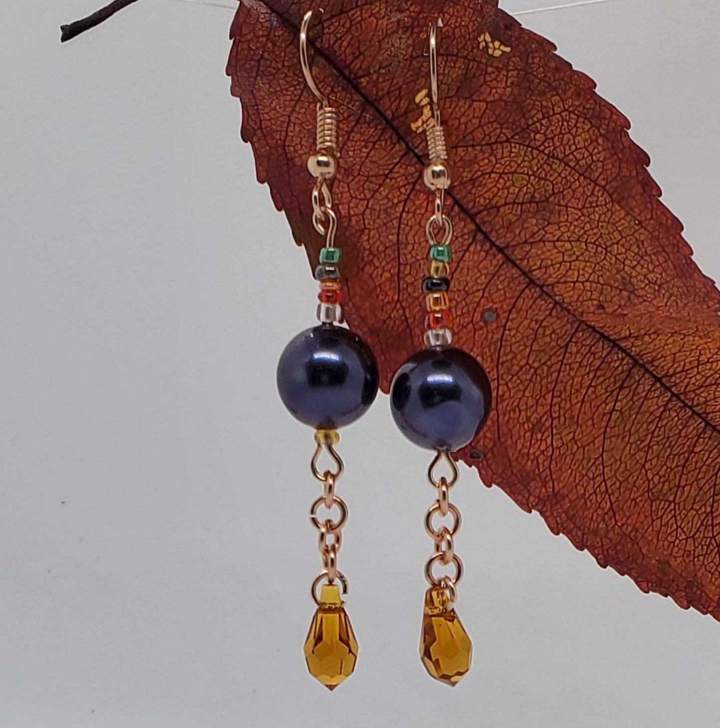 Earrings dangling from a leaf, Bisa Drop Earrings, earrings by Jiana Deon