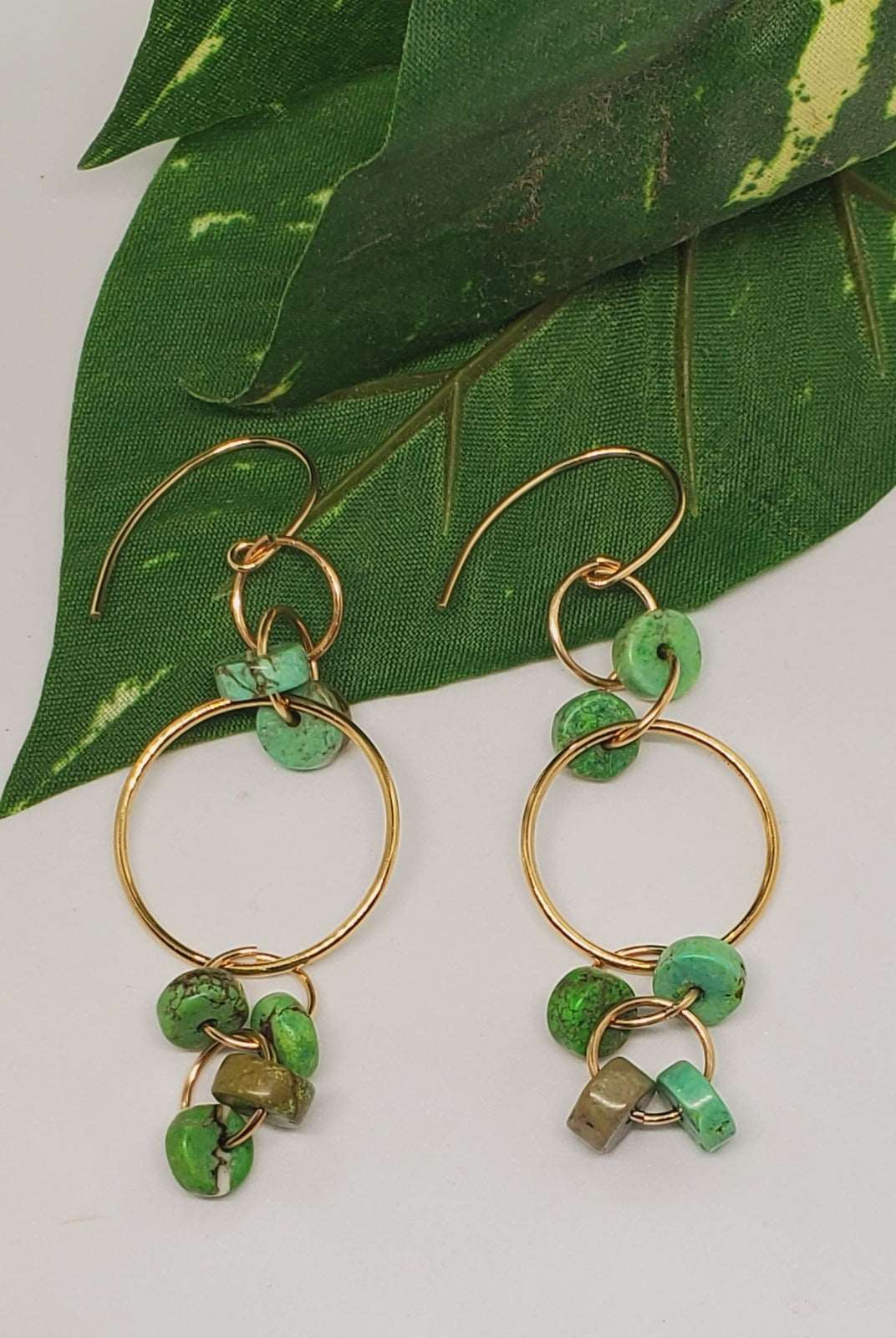 Photo of earrings on a green leaf, handmade earrings, Sydney Dangle Earrings