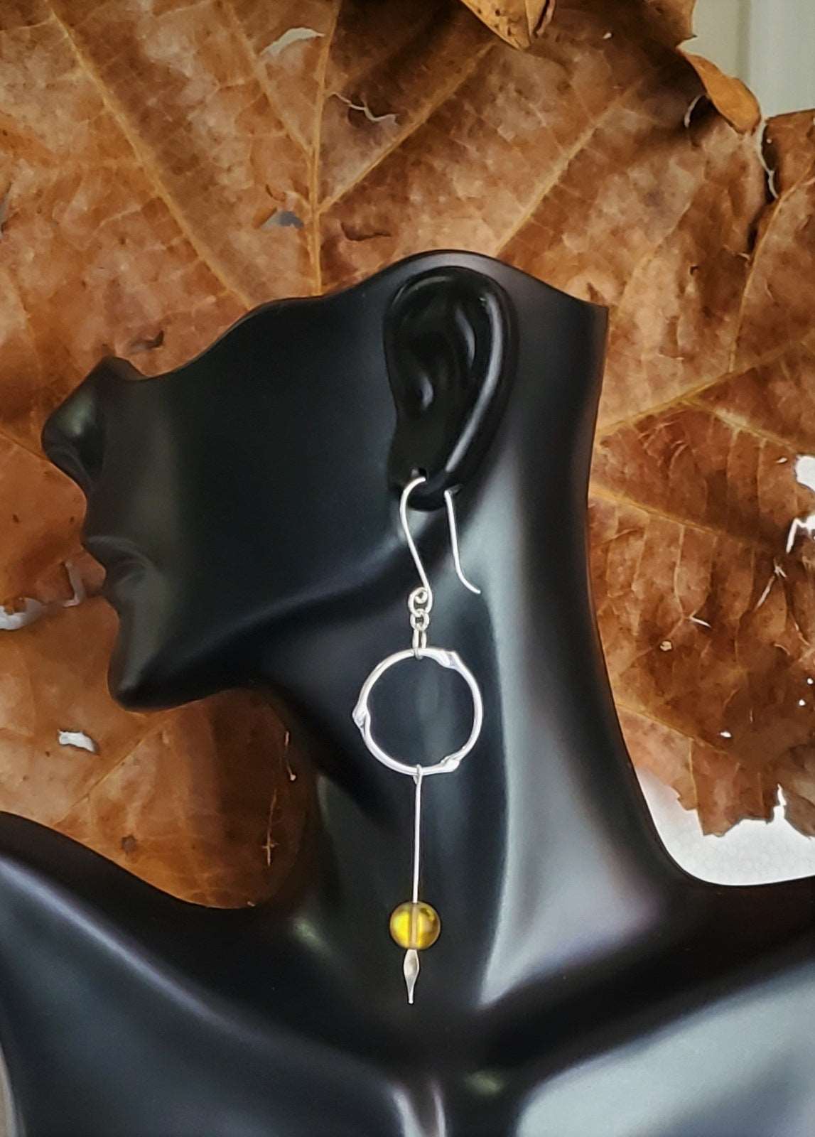Earrings with leaf background, earring with bead, dangle earrings on bust, sideview earring display, handmade earrings, Mystix Drop Earrings