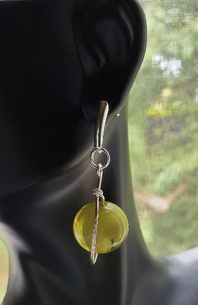 Margreen Dangle Drop Earrings, green earrings on bust side view in window, handmade earrings