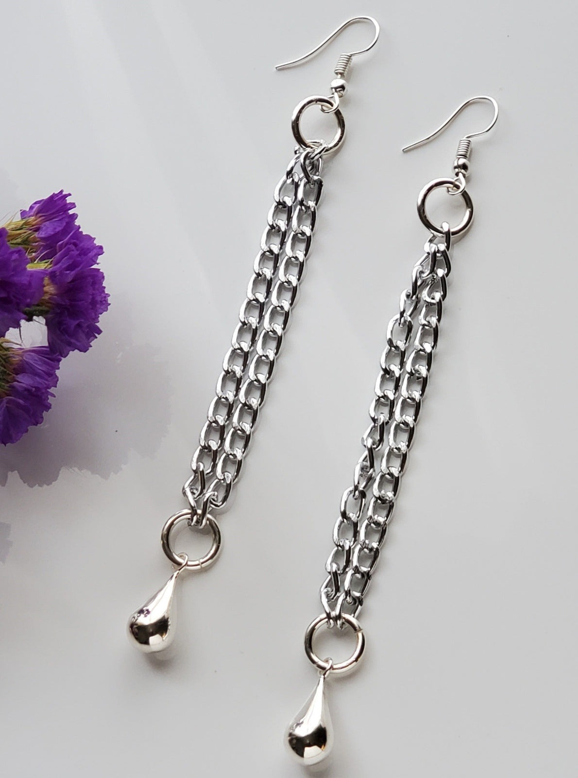 Earrings, Chain Teardrop Earrings, handmade, silver beside purple flower photo