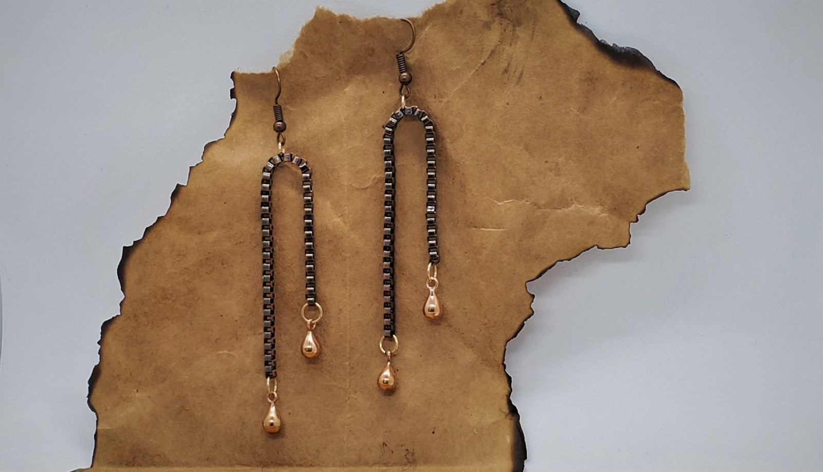 Earrings for women, Copper Chain Dangle Earrings, handmade earrings, photo of copper earrings on paper