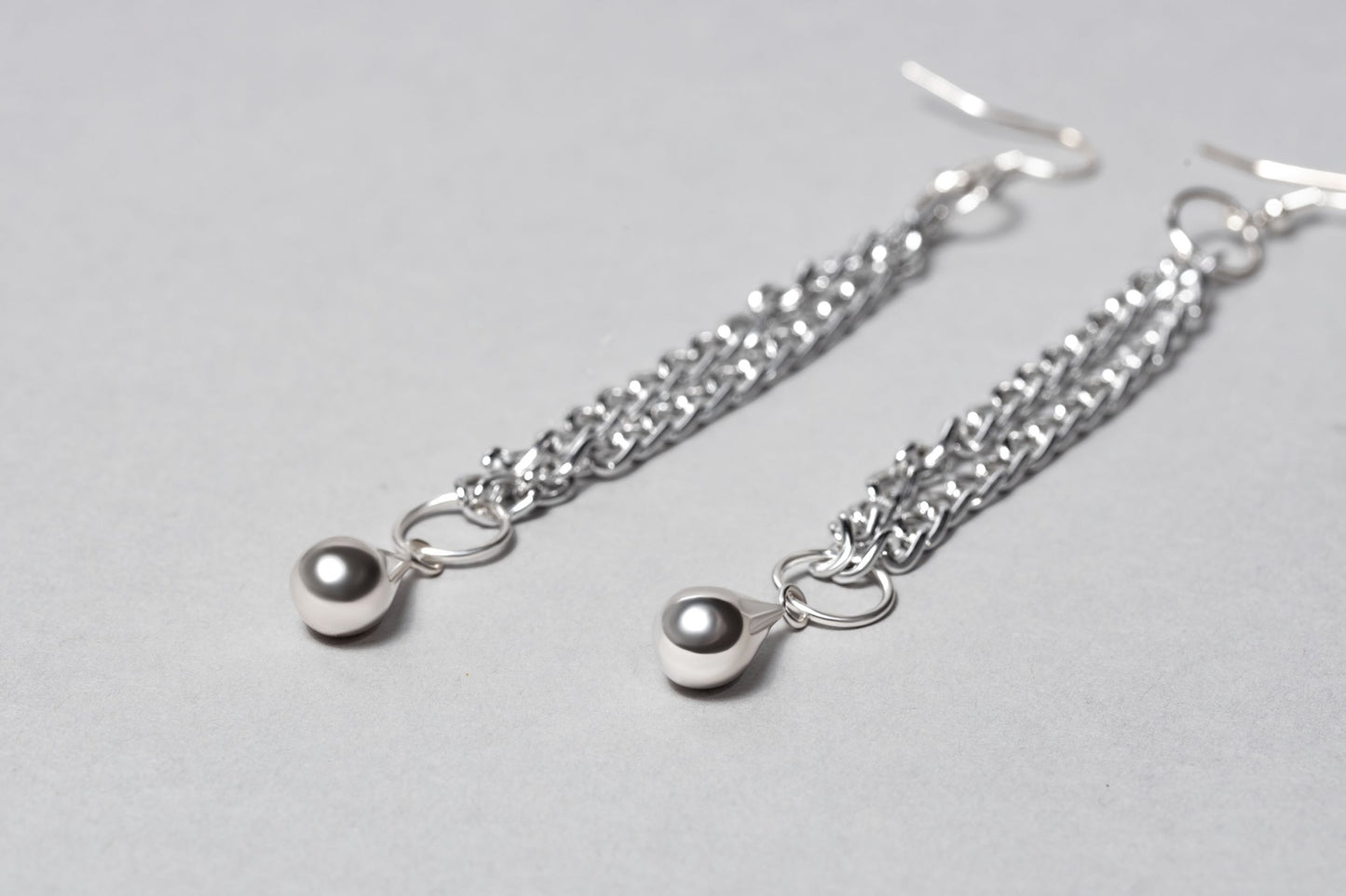 dhain Earrings for women, Chain Teardrop Earrings, handmade, close up silver earrings on chain photo